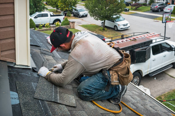 Professional Roof Replacement technician working in South Kent, CT